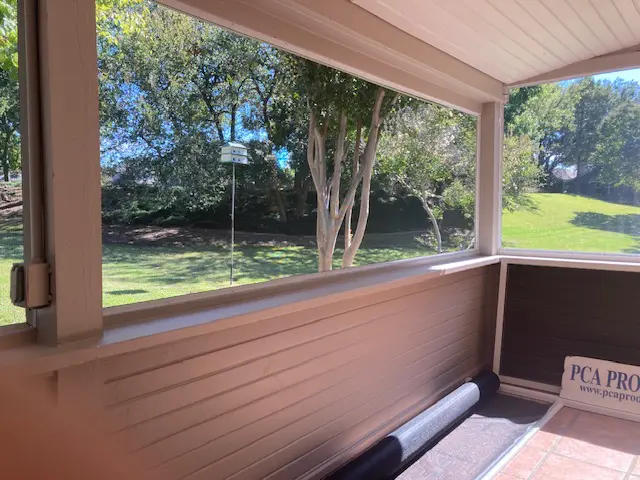 A view of trees from inside the house.