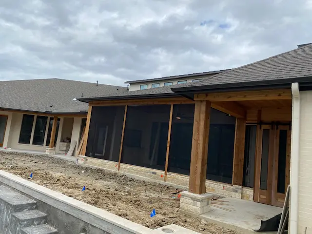 A building that has been built with wood and mesh.